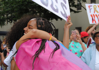 Giving a  stranger a hug is an act of kindness.