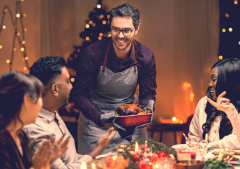Friends enjoying Christmas dinner together.