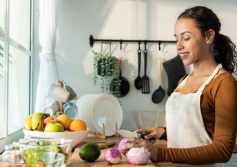 woman preparing a healthy vegan meal.