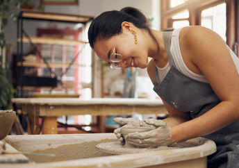 Potter working in clay or ceramics