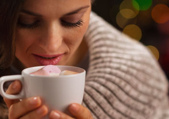 Enjoying a hot cocoa on a cold day.