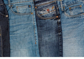 Multiple pairs of blue jeans.
