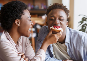 Sharing a romantic dessert on Valentine's Day.