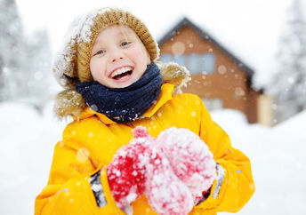 Child playing outside during the winter.