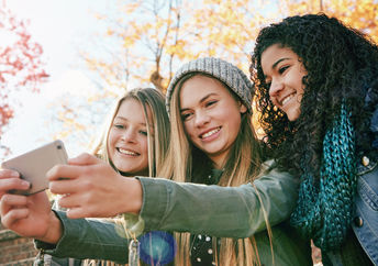 GenZ friends posting on social media.