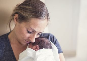 Cuddling a premature infant.