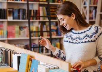 Choosing a book at a community bookseller.