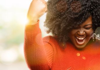 Woman celebrating a personal success.