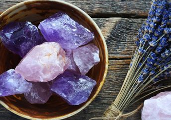 Pottery bowl with large rose quartz and amethyst crystals.