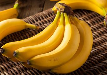 A  bunch of organic yellow bananas.