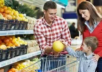 Family food shopping in a grocery store.