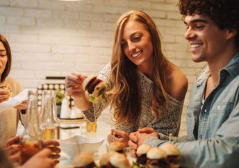 Next-gen friends eating out and enjoying time together.