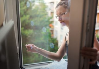 Placing reflective decals on a window.