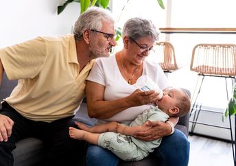 Grandparents babysitting their granschild.