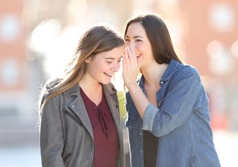 Two friends sharing good news.