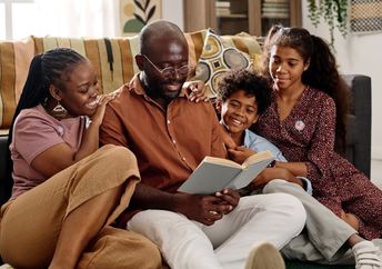 Reading books out loud as a family.