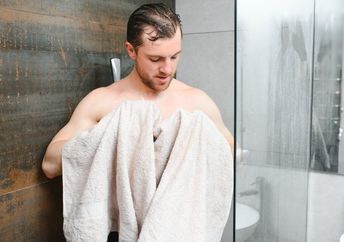 Drying off with a clean towel.