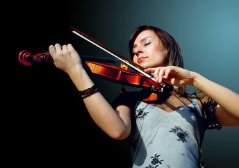 A musician playing a violin.