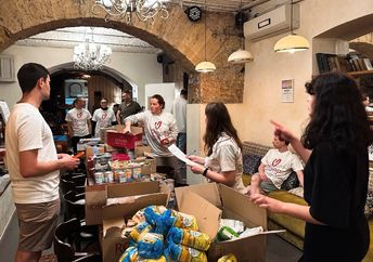 Volunteers in Odessa are packing food boxes for people in need.
