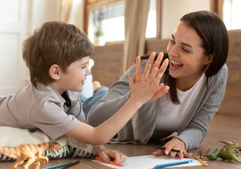 Mother and son celebrating an accomplishment.