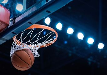 A basketball in the net.