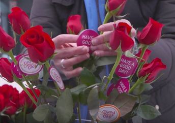 Giving out flowers on Good Deeds Day.