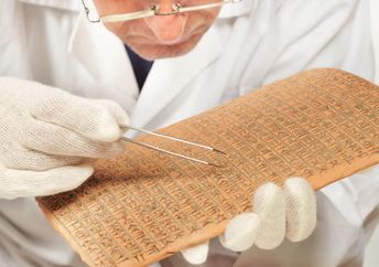Scientist exploring ancient cuneiform.