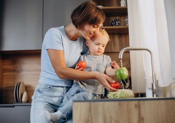 Washing vegetables before cooking.