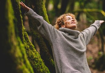 Happy woman enjoying being in nature.