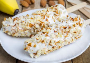 Frozen bananas coated with yogurt and almonds are a healthier choice.