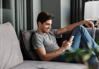 A man looks at his phone.