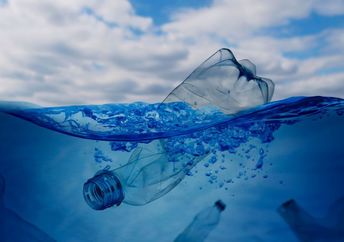A plastic bottle floating in the ocean.