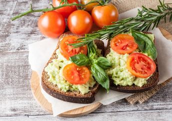 Avocado toast with tomatoes.