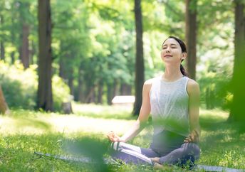 Woman meditating in nature.