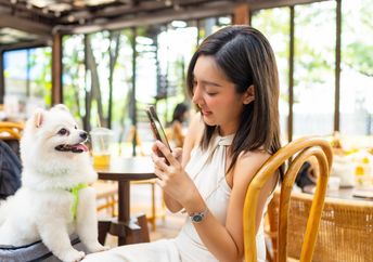 Pet parent posting a picture of having lunch with her baby.