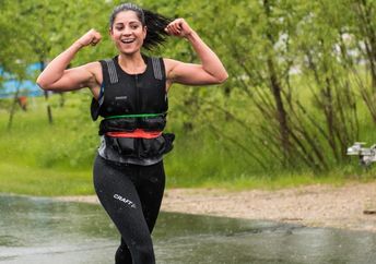 Woman walking with a weighted vest.