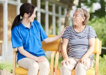 A young Japanese woman in a discussion with a grandma figure.