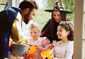 Handing out goodies to trick-or-treaters.