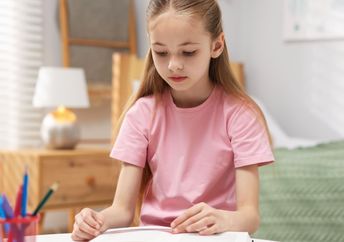 Dyslexic girl using a tool to help her read.