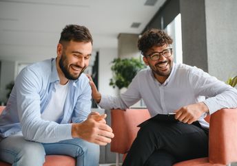 A therapist supports his patient.