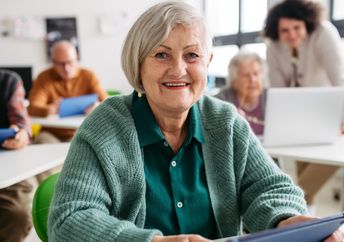 Seniors learning through hands-on activities.