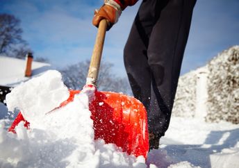 Shoveling snow from sidewalks.