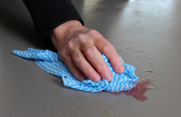 Cleaning up a liquid spill on a kitchen counter