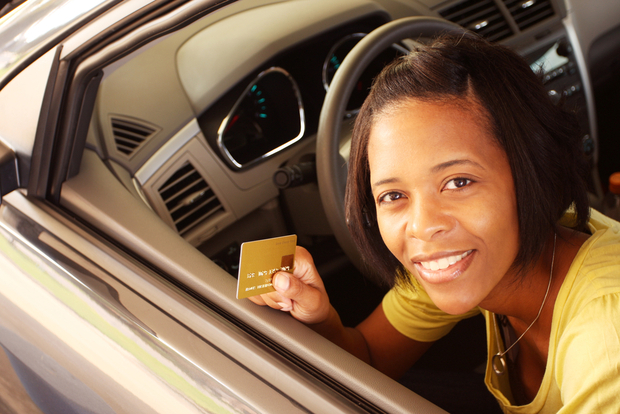 A woman pays with a credit card