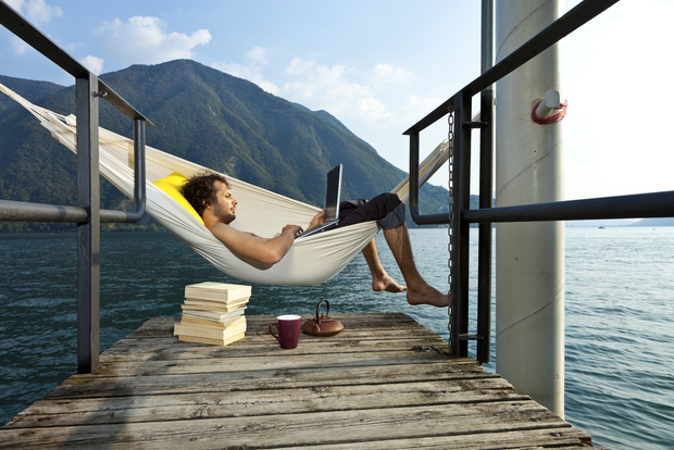 Man on hammock with laptop