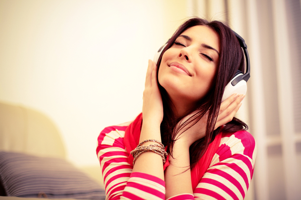 Happy woman listening to music