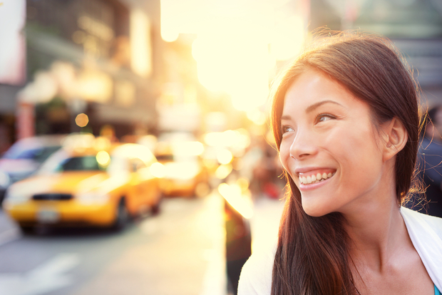 Woman smiles on the street