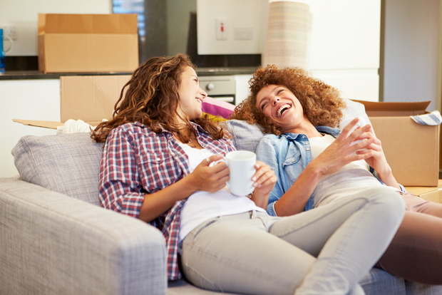 Happy friends in a new apartment