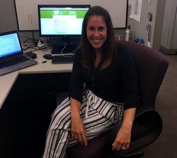 Andrea Thomas at her desk in Points of Light's Atlanta office