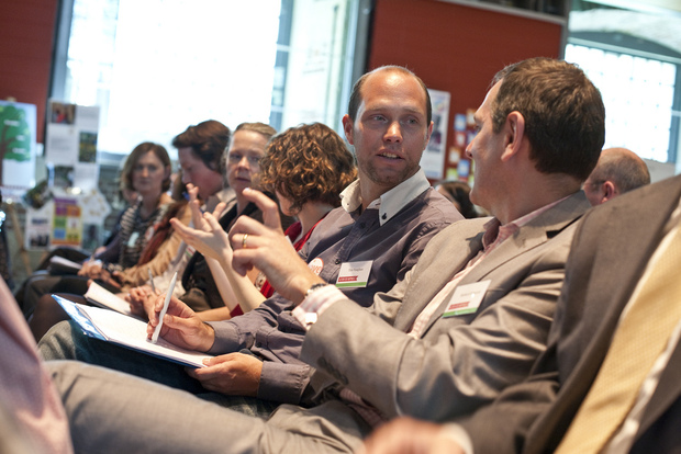 Participants discuss happiness at a Action for Happiness event.